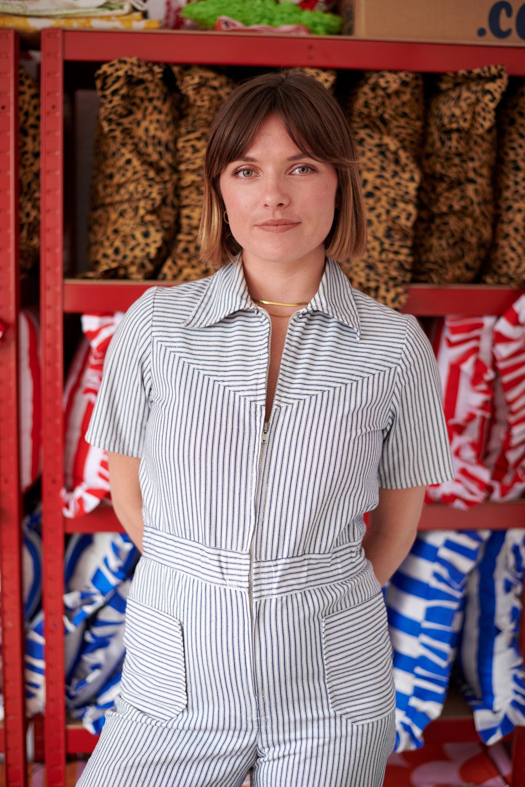 Image may contain Blouse Clothing Adult Person Sleeve Accessories Jewelry Necklace Shirt and Box