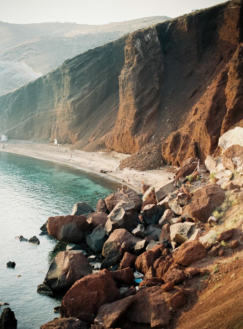 Image may contain: Rock, Cliff, Nature, Outdoors, Sea, Water, Beach, Coast, Shoreline, Scenery, Promontory, and Wilderness