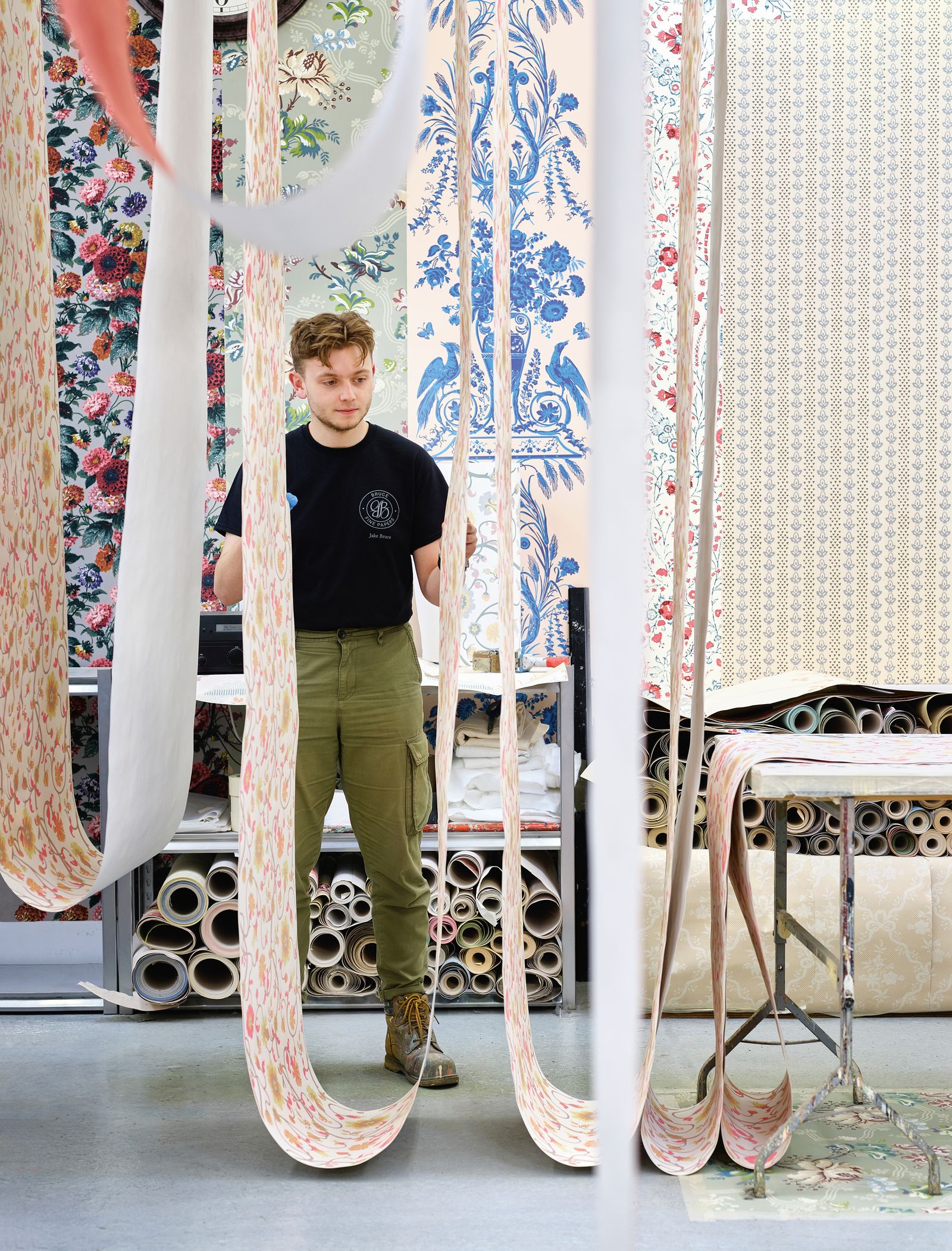 Image may contain Person Teen Clothing Footwear Shoe Pants Indoors Interior Design Furniture Bed Bedroom and Room