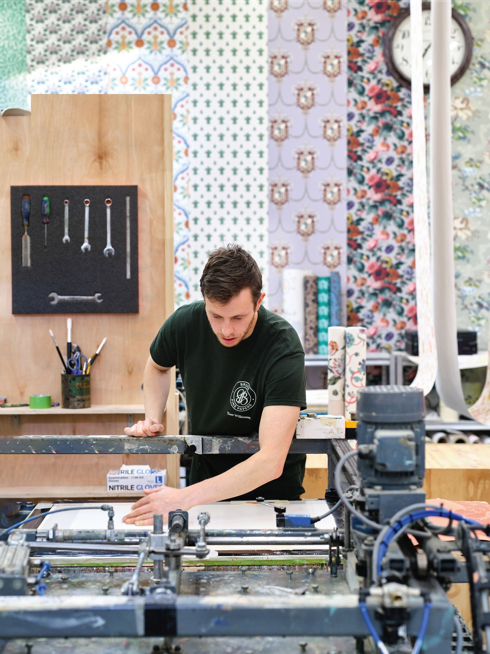 Image may contain Person Teen Cup Architecture Building Factory Device Screwdriver Tool Tape Clothing and Glove