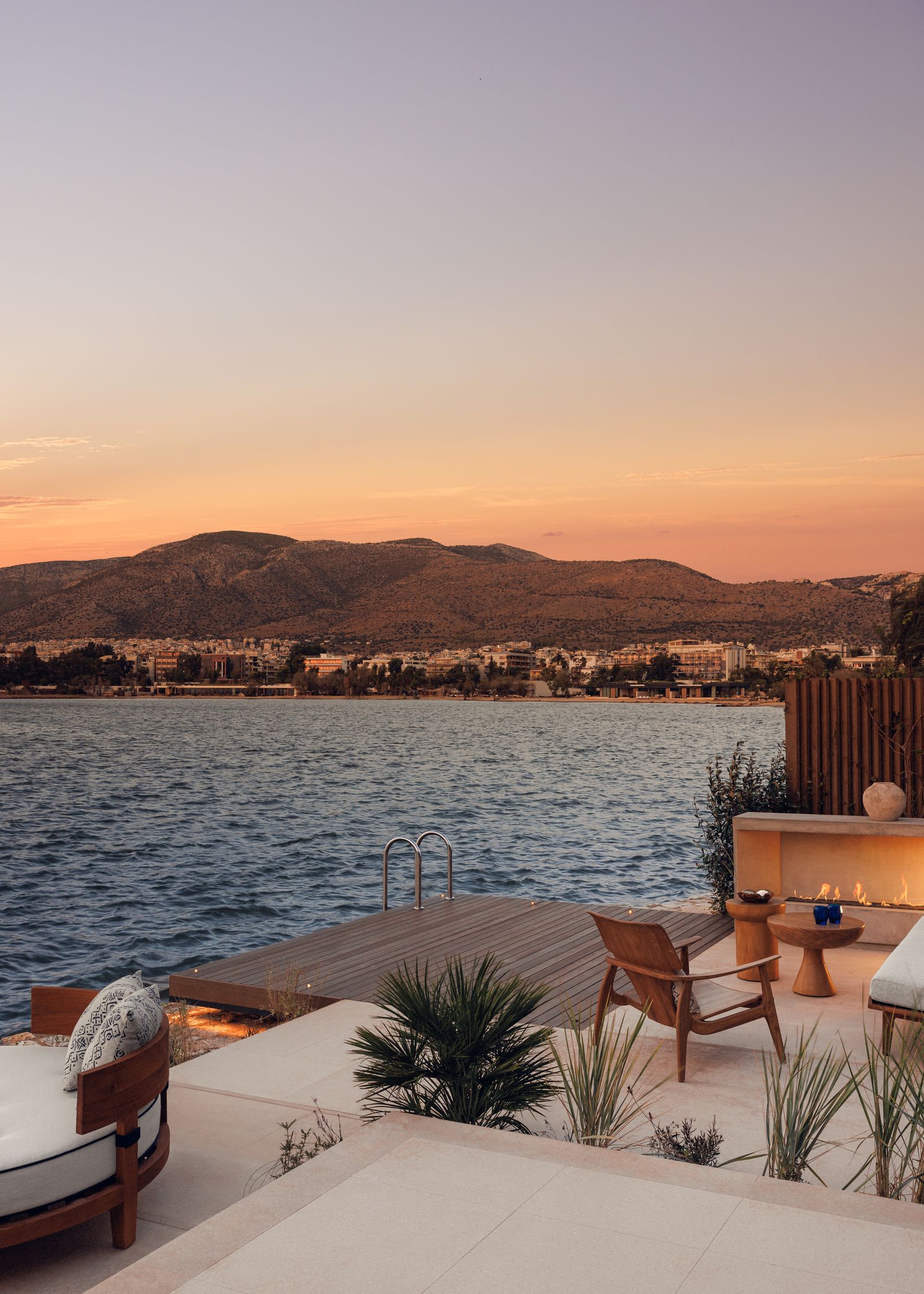 Image may contain Nature Outdoors Scenery Chair Furniture Water Waterfront Table Lakefront Landscape and Sky