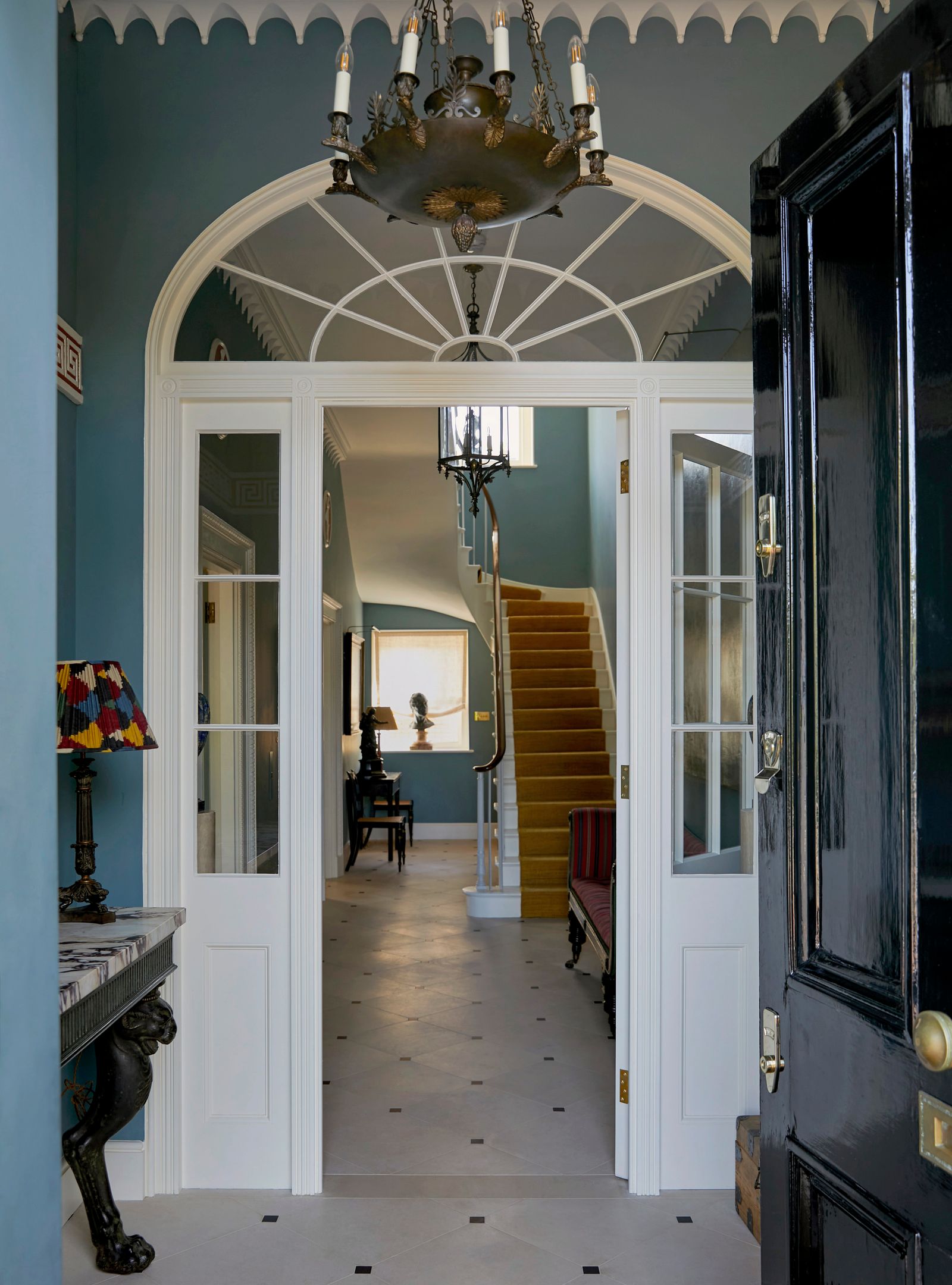 Image may contain Lamp Architecture Building Foyer Indoors Chair Furniture Box Candle Desk and Table