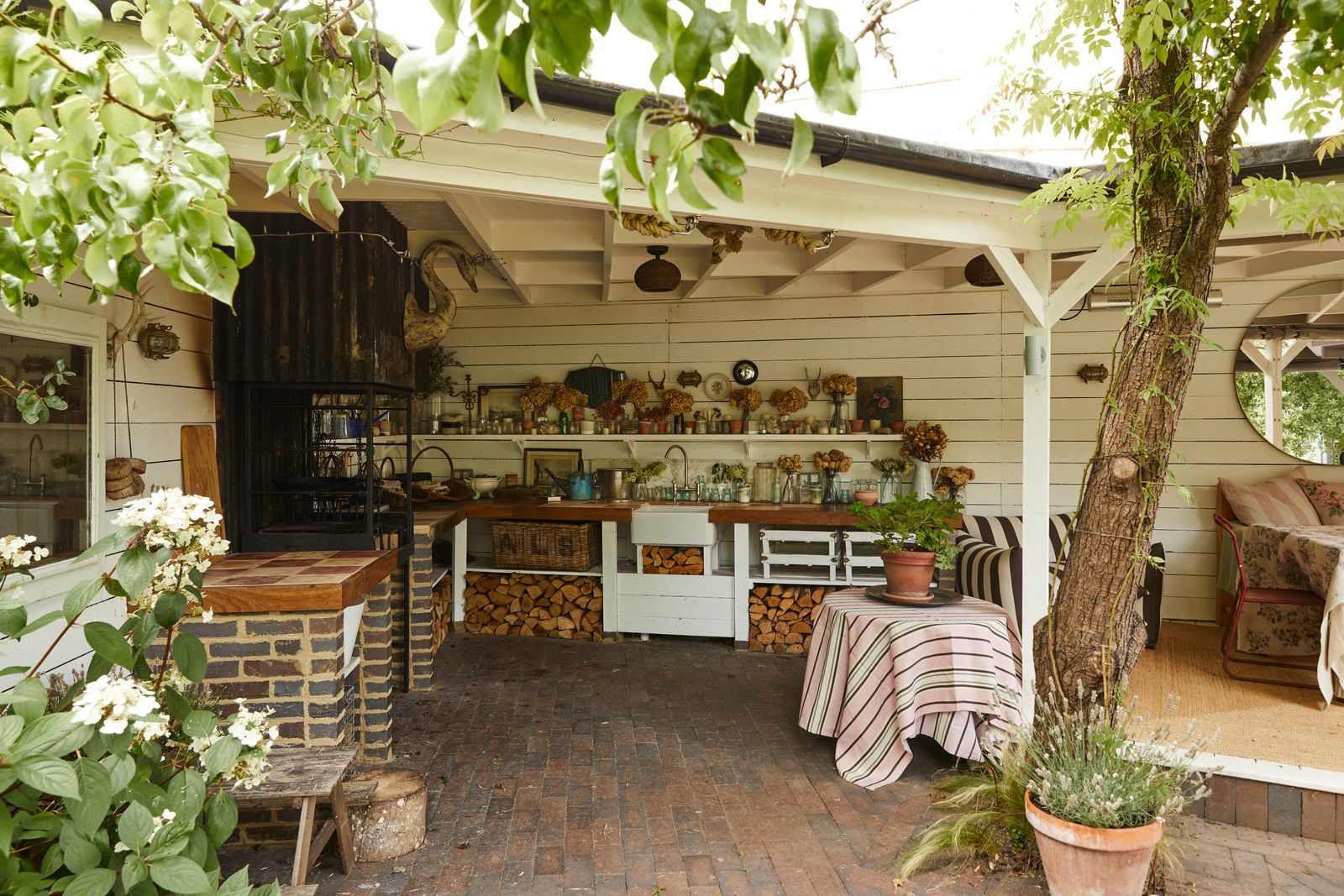 Image may contain Indoors Interior Design Plant Potted Plant Architecture Building House Housing Porch and Wood