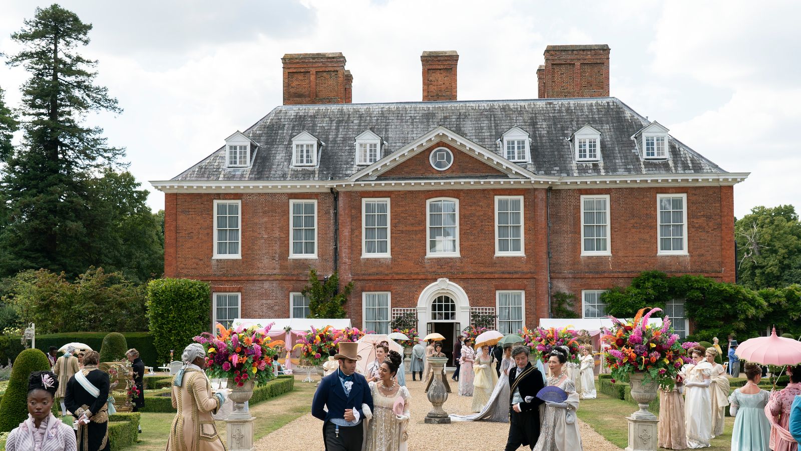 Image may contain: Person, Clothing, Hat, Dress, Fashion, Formal Wear, Gown, Wedding, Wedding Gown, Walking, and Footwear