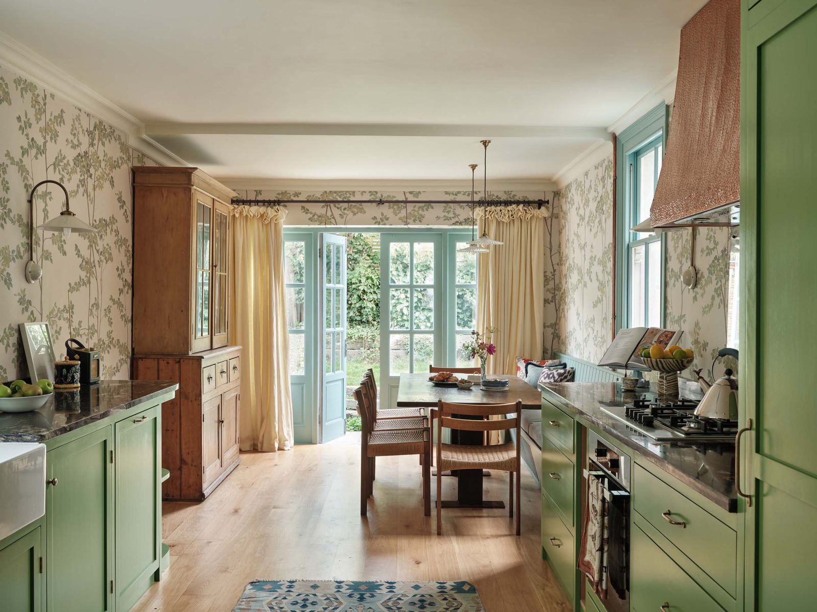 Image may contain Indoors Interior Design Lamp Home Decor Rug Chair Furniture Kitchen Cooktop Door and Accessories