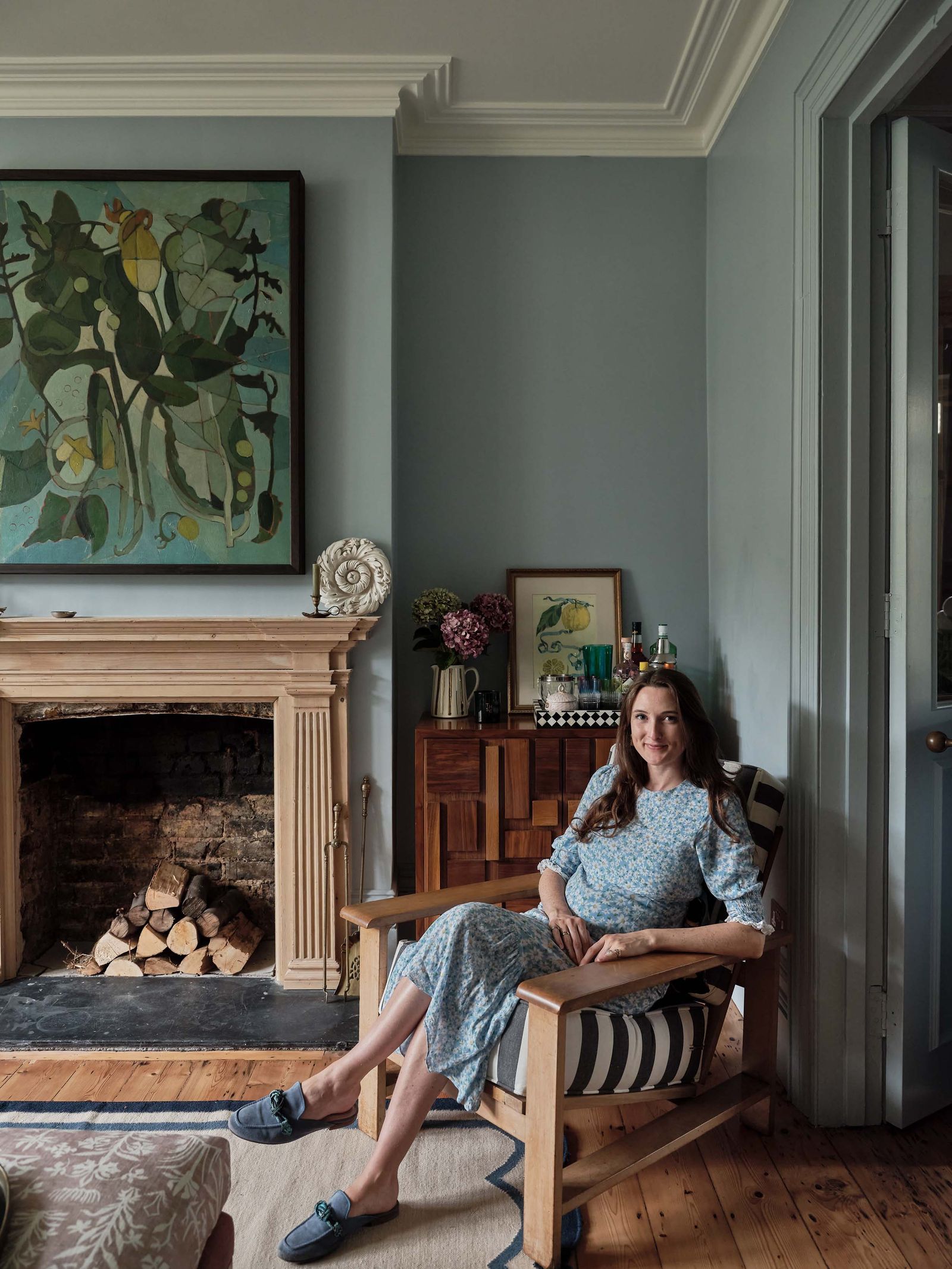 Image may contain Person Sitting Chair Furniture Clothing Footwear Shoe Adult Art Painting and Indoors