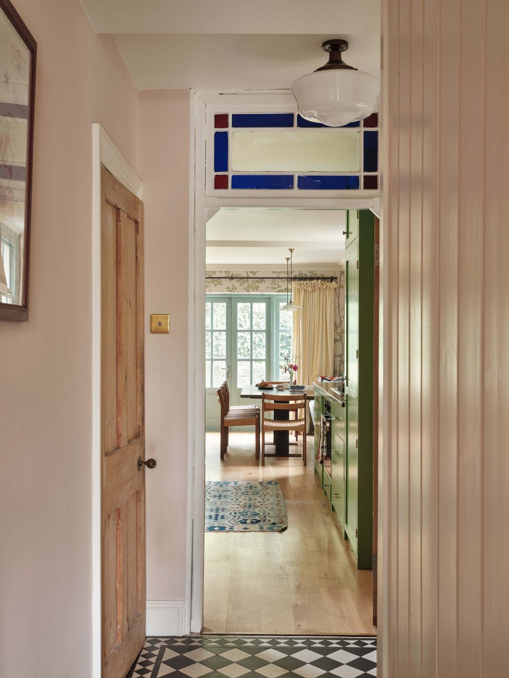 Image may contain Home Decor Rug Floor Indoors Chair Furniture Interior Design Architecture Building and Foyer