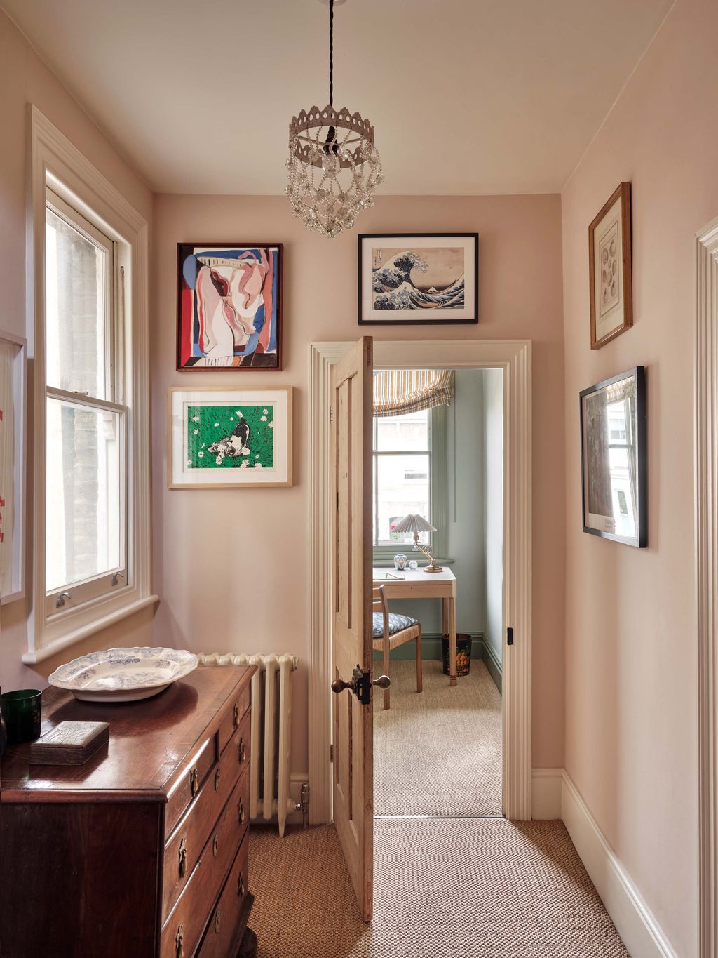 Image may contain Corner Lamp Desk Furniture Table Chair Art Painting Indoors Interior Design Cup and Chandelier