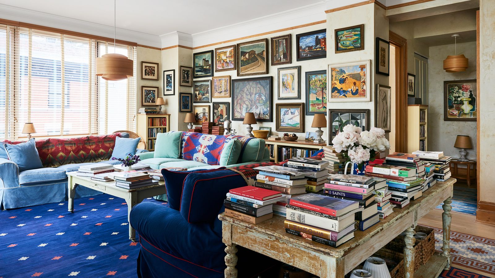 Image may contain: Home Decor, Lamp, Couch, Furniture, Art, Painting, Desk, Table, Architecture, Building, and Indoors