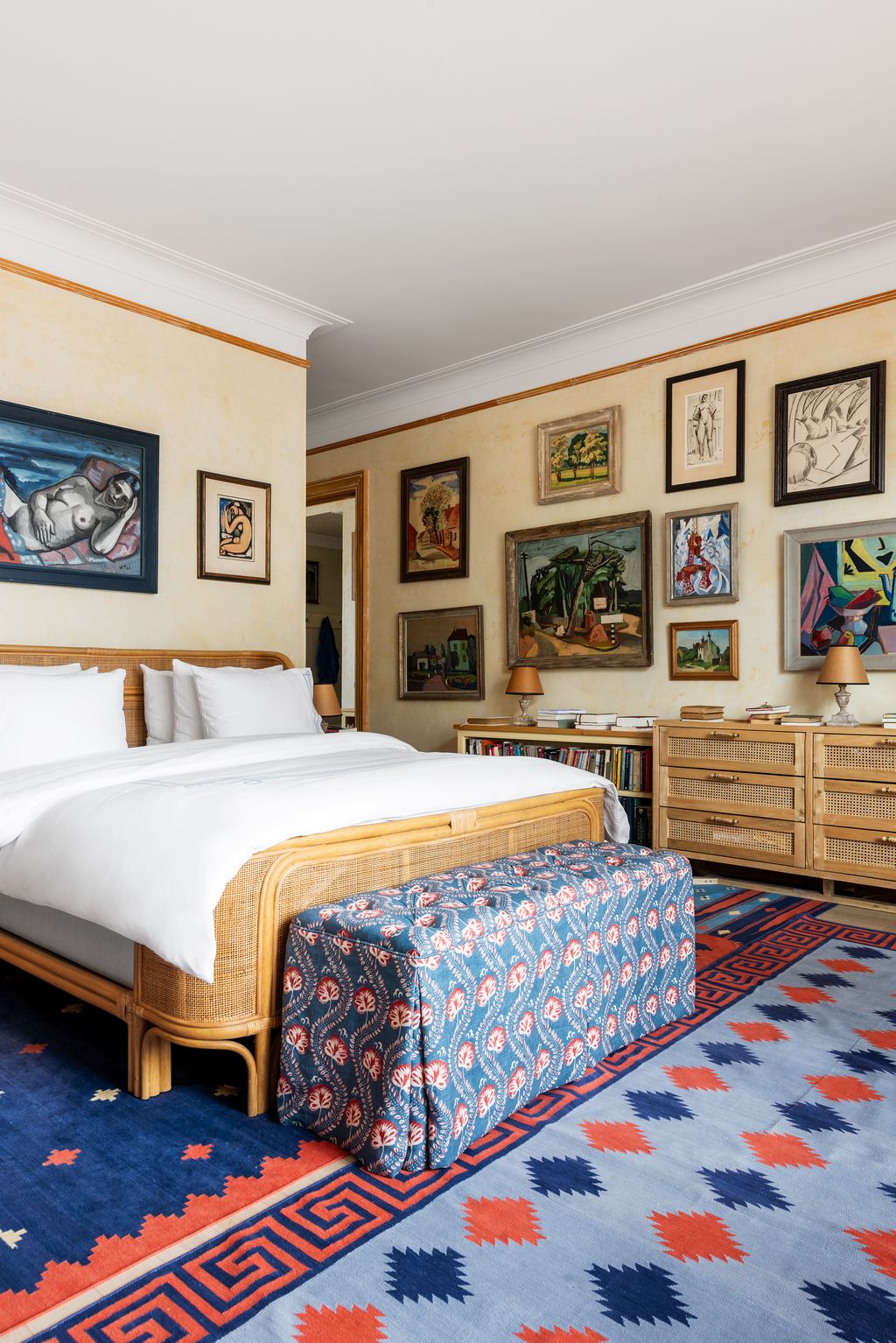 Image may contain Home Decor Rug Lamp Indoors Interior Design Art Painting Bed Furniture Bedroom Room and Person