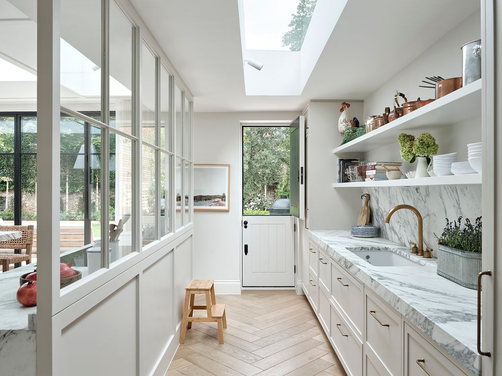 Image may contain Indoors Interior Design Sink Sink Faucet Chair Furniture Plant Window Animal Bird and Chicken