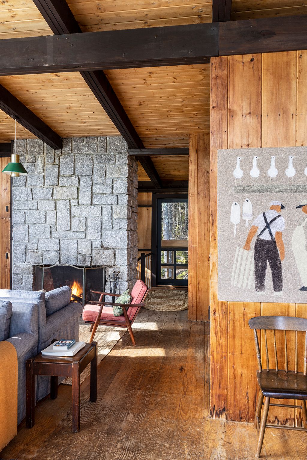 Image may contain Indoors Interior Design Wood Chair Furniture Book Publication Hardwood Lamp Home Decor and Rug