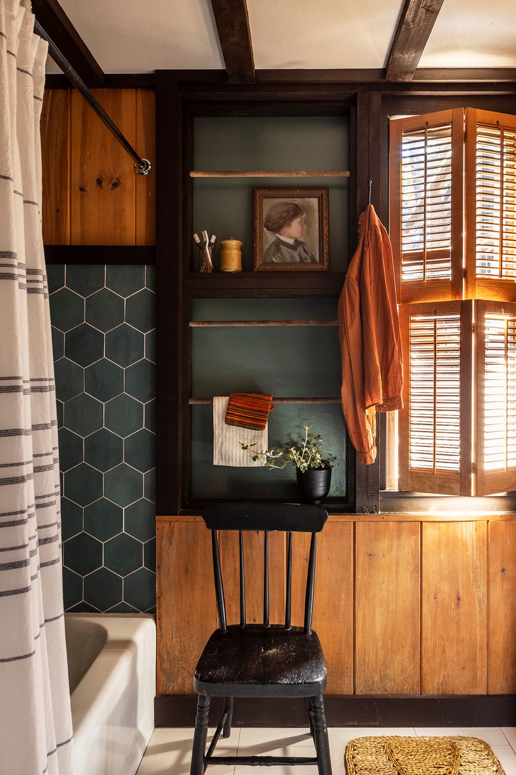 Image may contain Indoors Interior Design Chair Furniture Art Painting Person Bathing Bathtub Tub and Hardwood