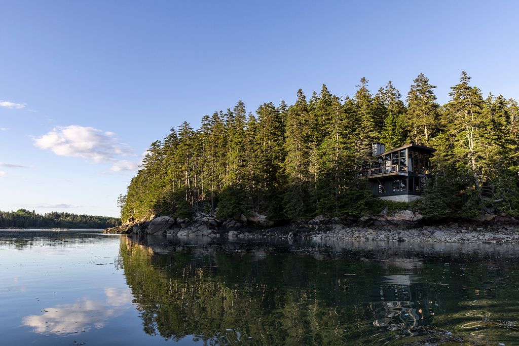 Image may contain Nature Outdoors Scenery Land Plant Vegetation Lake Water Tree Landscape Woodland and Sea