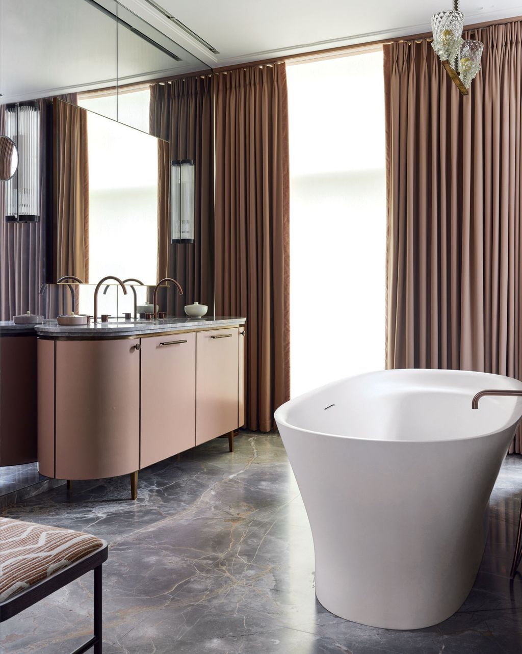 Image may contain Bathing Indoors Interior Design Bathtub Person Tub Sink and Sink Faucet