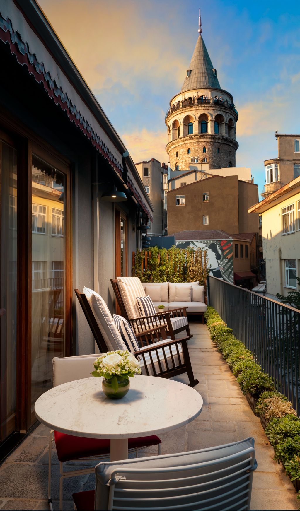 Image may contain City Chair Furniture Desk Table Plant Potted Plant Architecture Bell Tower Building and Tower