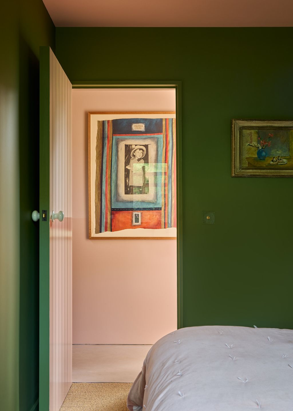 Image may contain Corner Indoors Interior Design Art Painting Person Home Decor Furniture Bed Rug and Bedroom