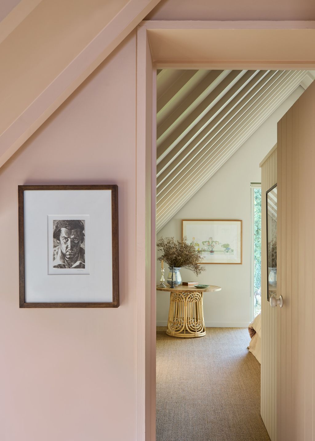 Image may contain Indoors Interior Design Art Painting Desk Furniture Table Adult Person Floor and Plant