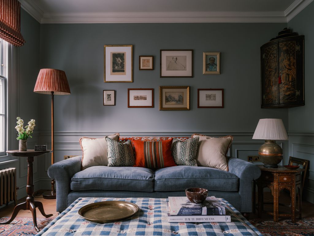 Image may contain Home Decor Lamp Couch Furniture Architecture Building Indoors Living Room Room Art and Painting