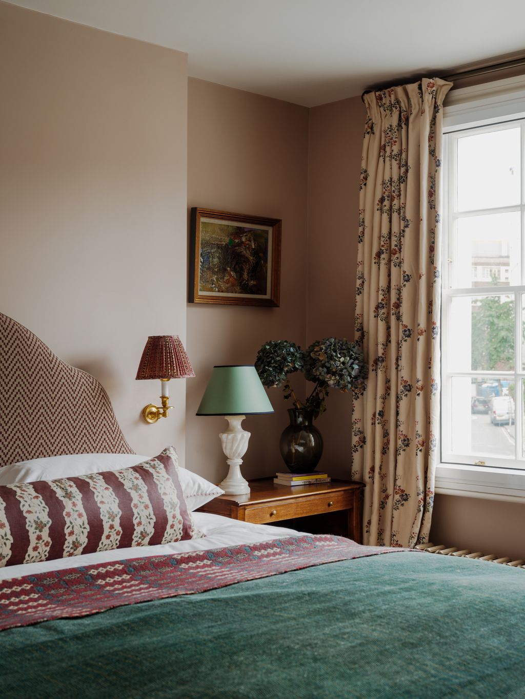 Image may contain Lamp Home Decor Table Lamp Art Painting Cushion Bed Furniture Book Publication and Car