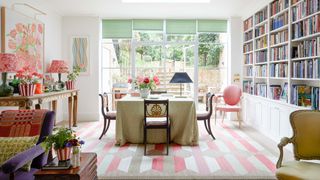 Image may contain Home Decor Lamp Chair Furniture Desk Table Book Publication Plant Architecture and Building