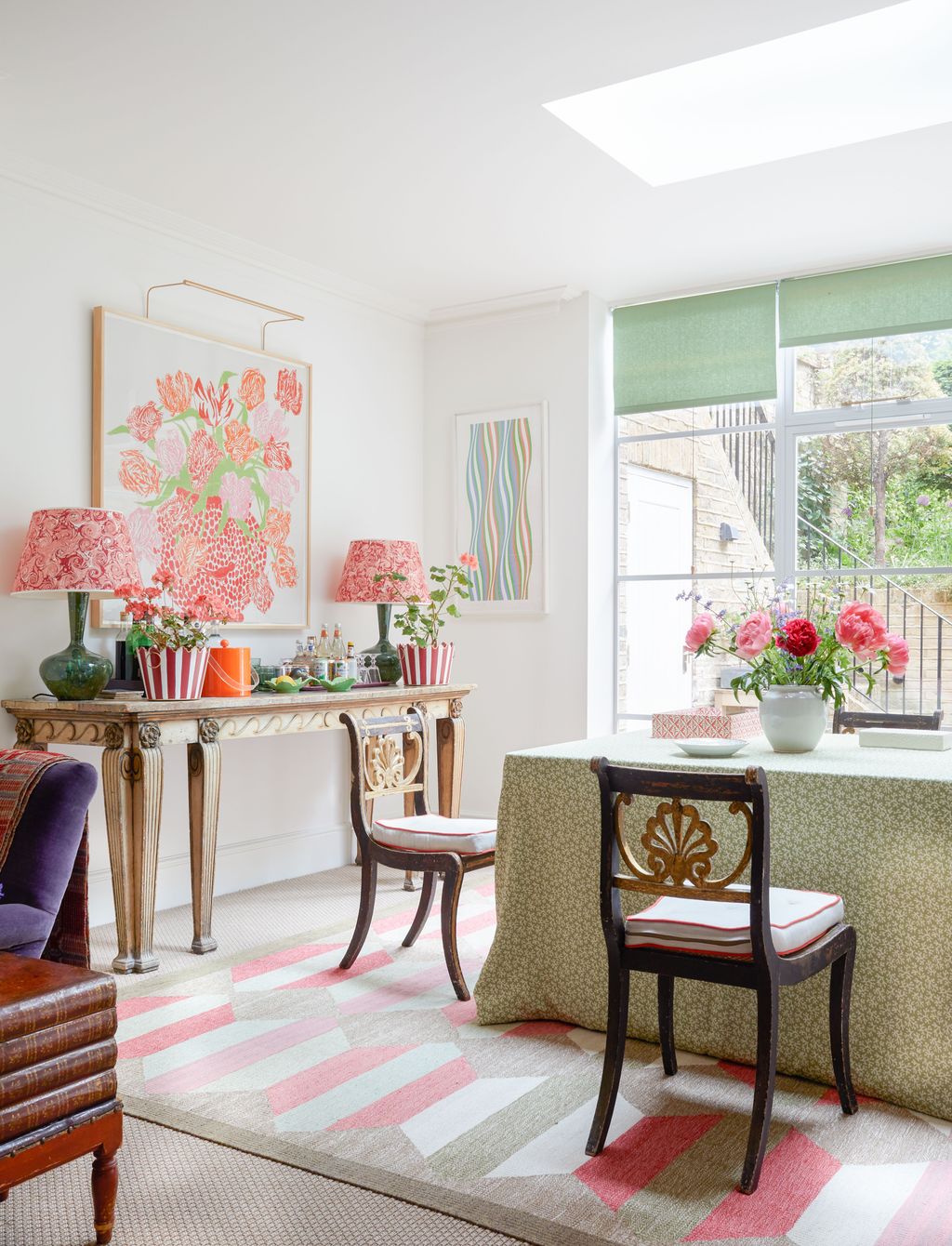 Image may contain Home Decor Lamp Chair Furniture Desk Table Rug Plant Cup Plate Window Art and Painting