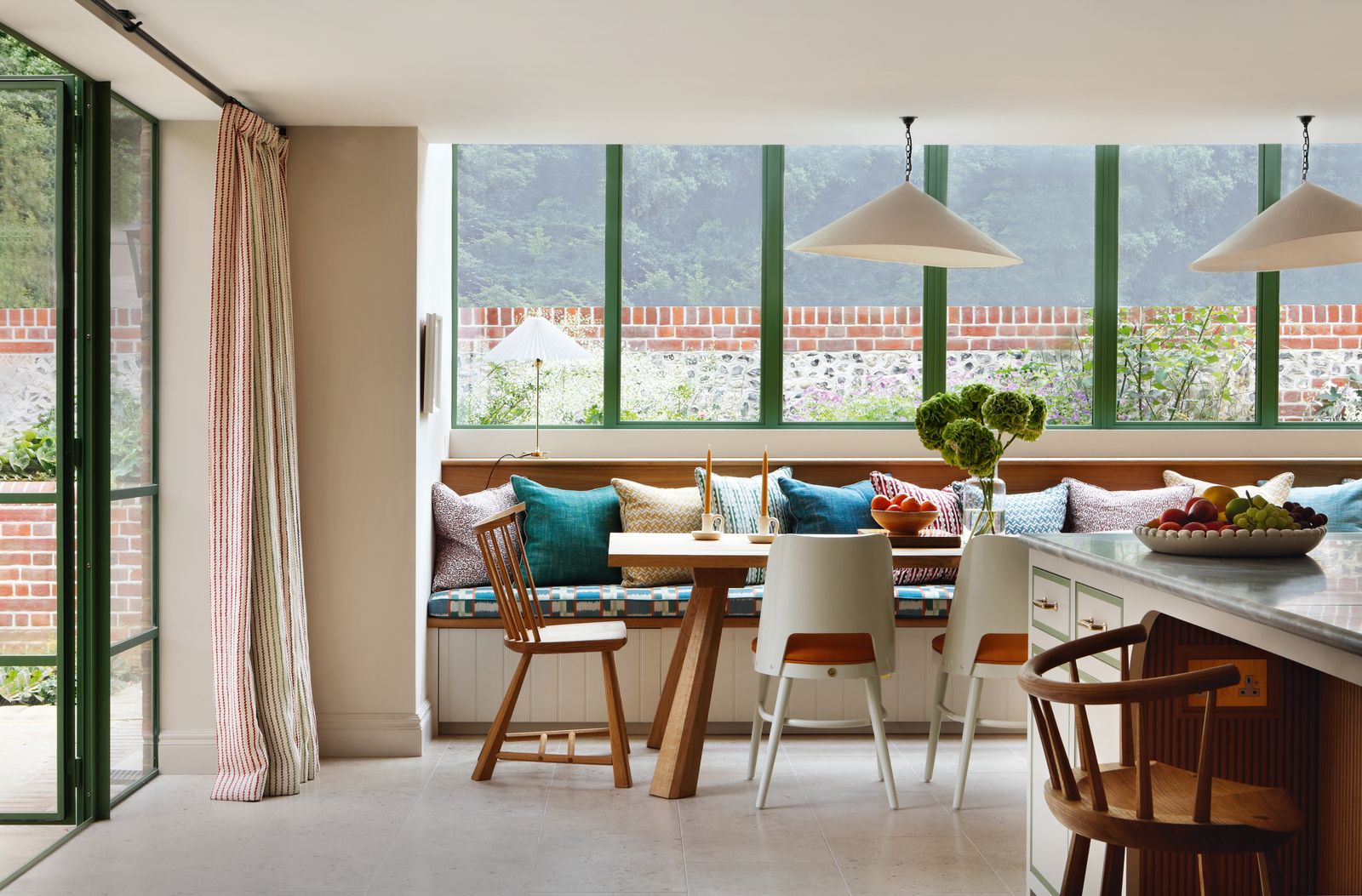 Image may contain Chair Furniture Lamp Plant Window Architecture Balcony Building and Table