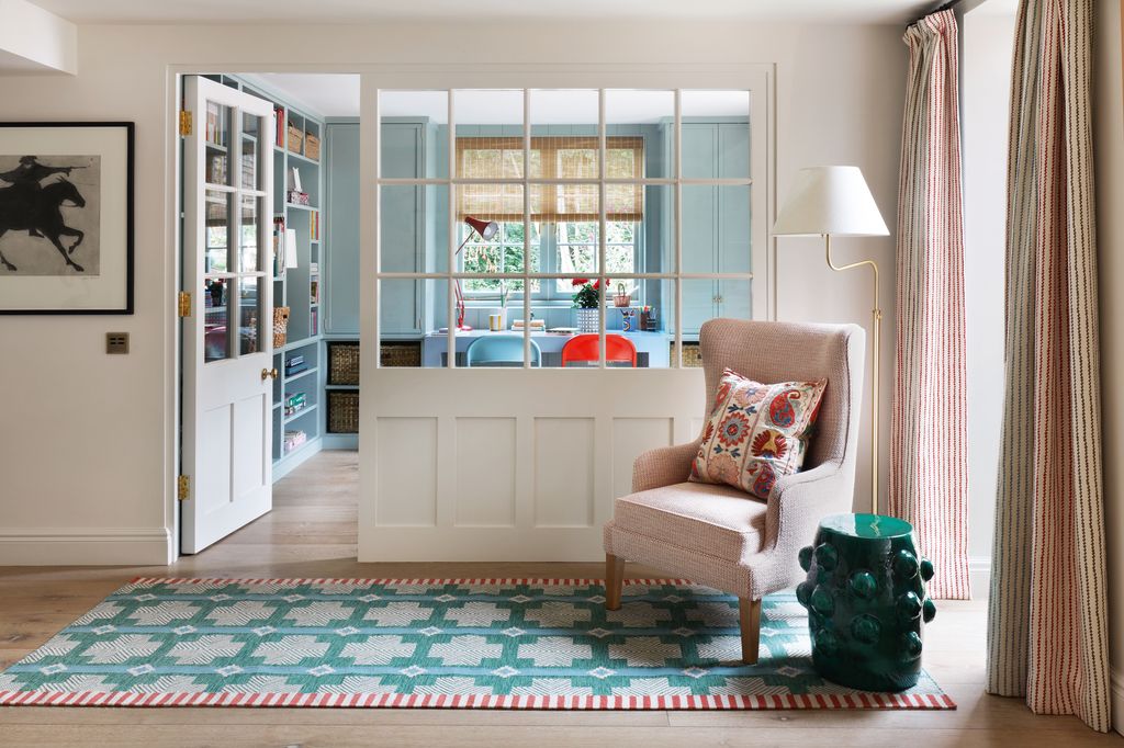 Image may contain Home Decor Chair Furniture Rug Door Art Painting Architecture Building Housing Lamp and Animal