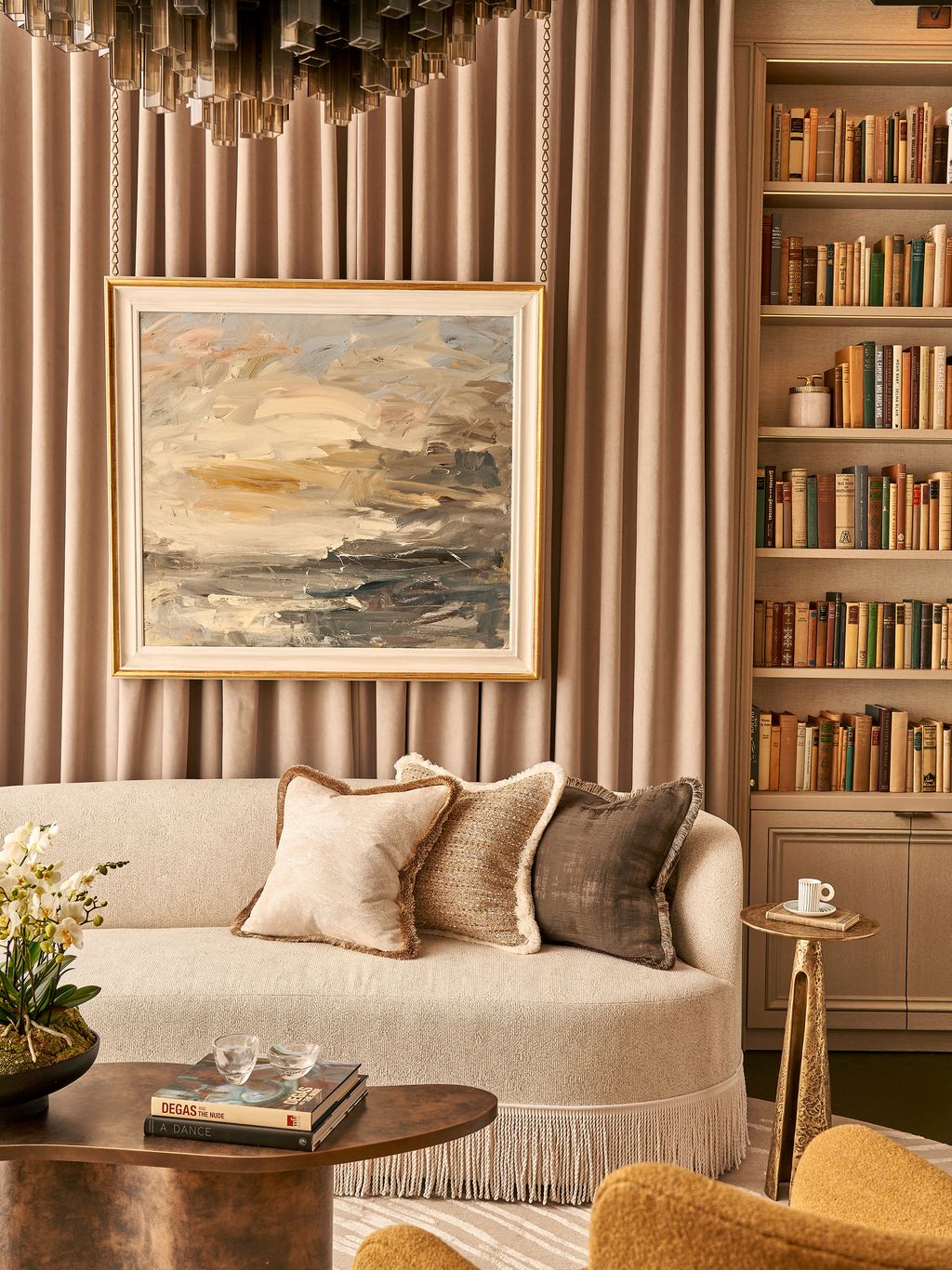 Image may contain Indoors Interior Design Home Decor Art Painting Book Publication Cushion Couch Furniture and Cup