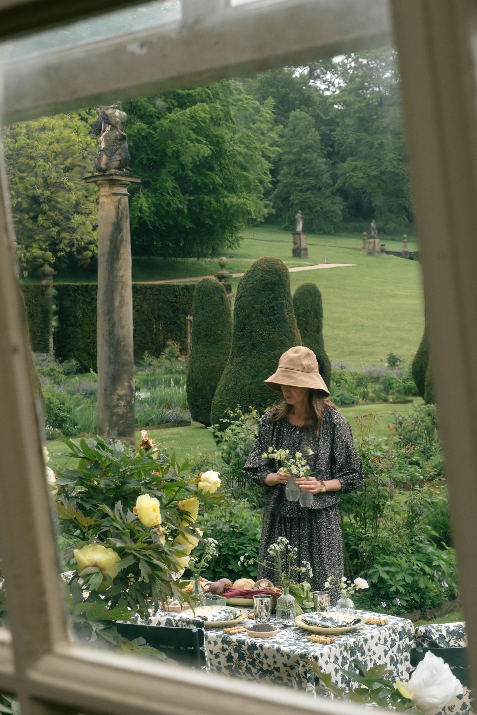 Image may contain Plant Potted Plant Garden Nature Outdoors Grass Vegetation Jar Planter Pottery Vase and Tree