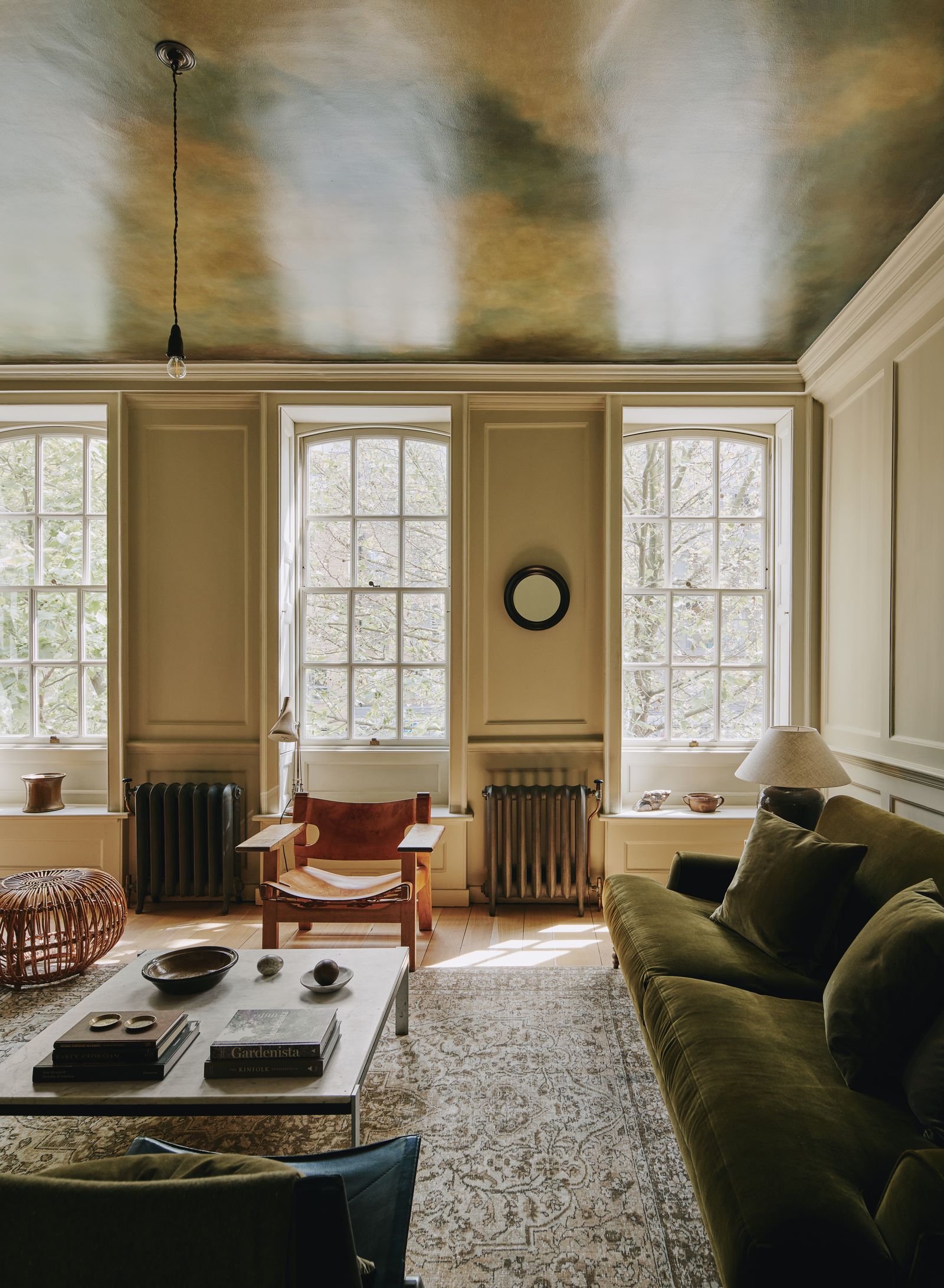 Image may contain Book Publication Couch Furniture Home Decor Rug Lamp Plate Chair Window and Architecture