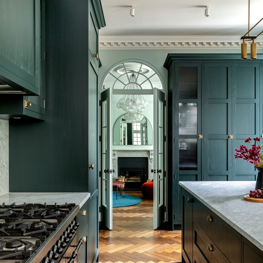 Image may contain Indoors Kitchen Interior Design Cooktop Home Decor Rug Door Floor Couch and Furniture