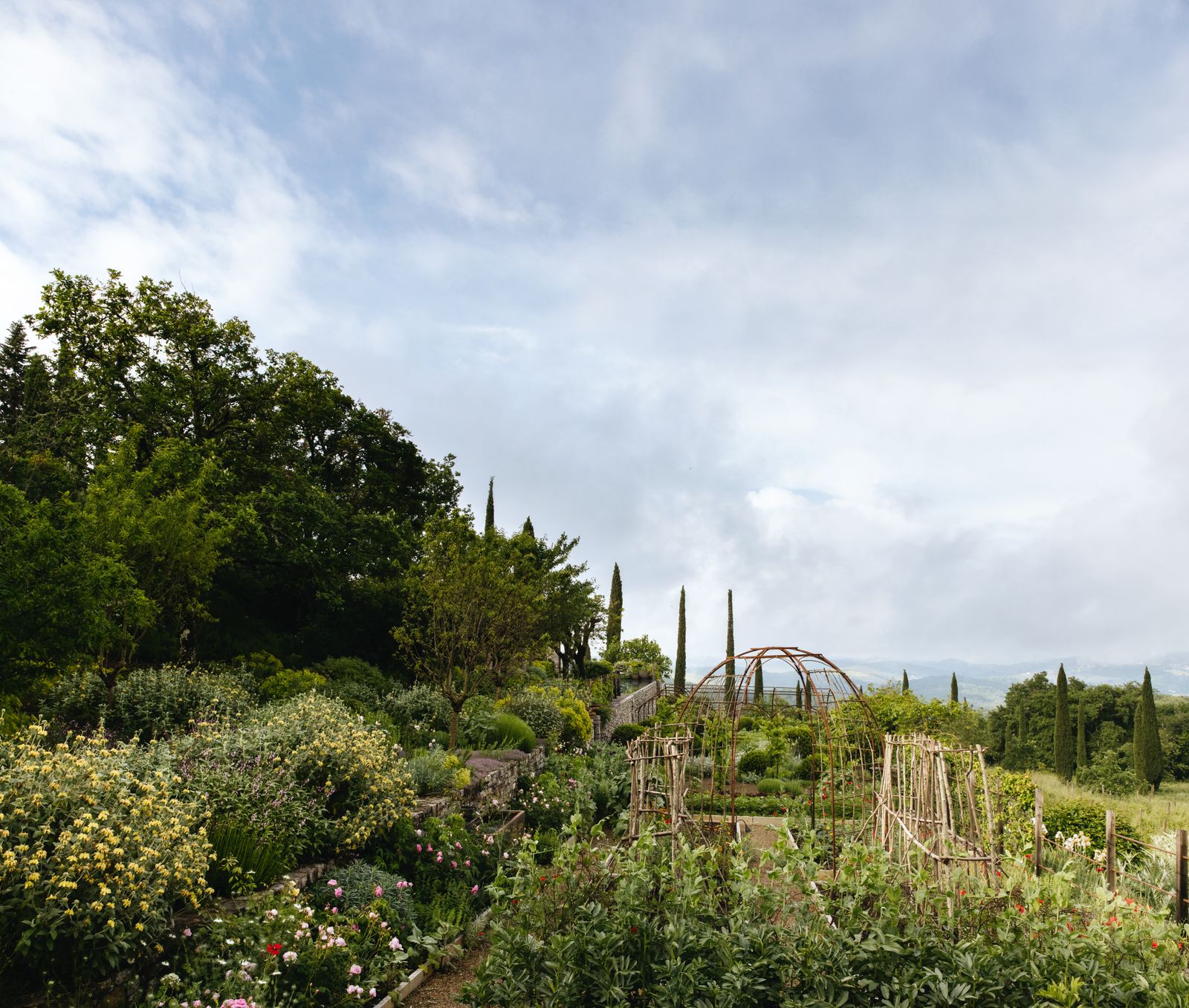 Image may contain Garden Nature Outdoors Grass Park Plant Vegetation Amusement Park Fun Theme Park Grove and Land