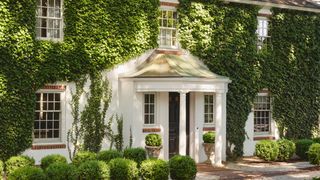Image may contain Plant Architecture Building Housing House Portico and Cottage