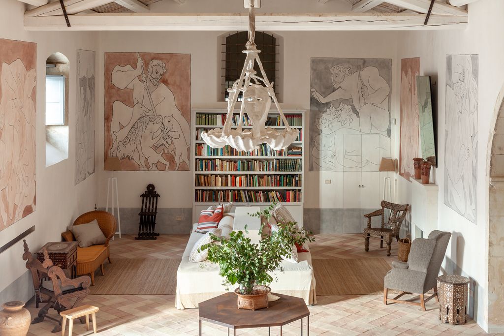 Image may contain Home Decor Chair Furniture Architecture Building Indoors Living Room Room and Dining Room