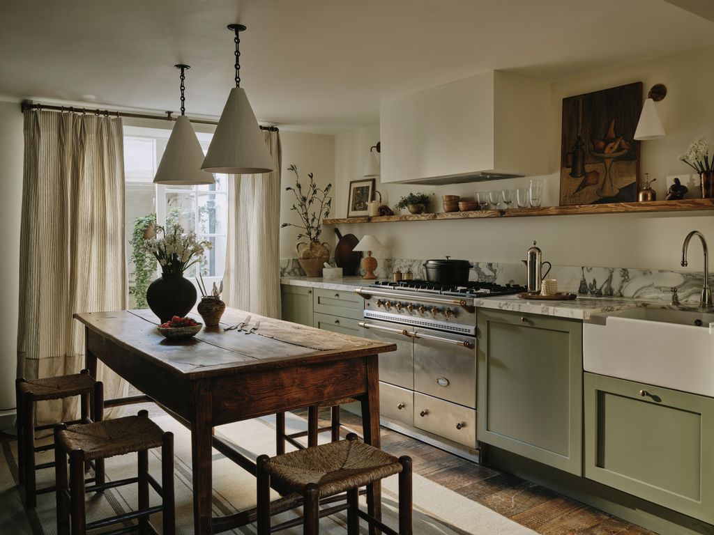 Image may contain Indoors Kitchen Architecture Building Dining Room Dining Table Furniture Room and Table