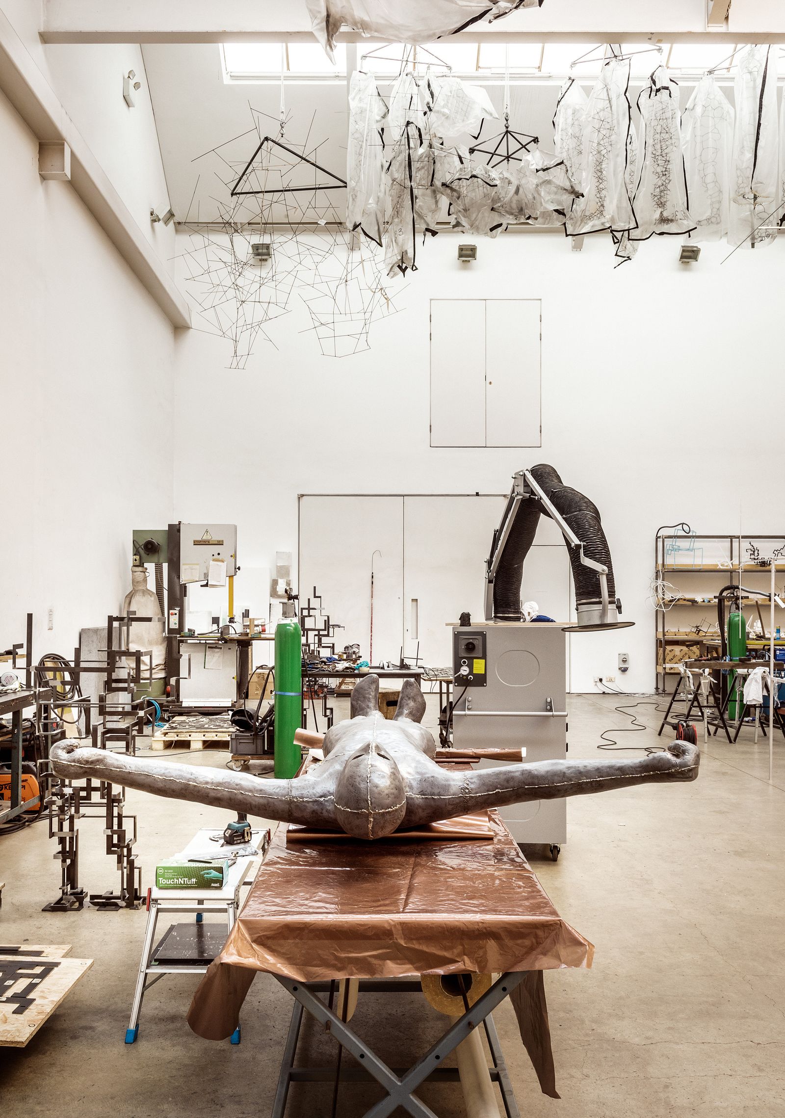 Image may contain Architecture Building Factory Manufacturing Workshop Adult and Person