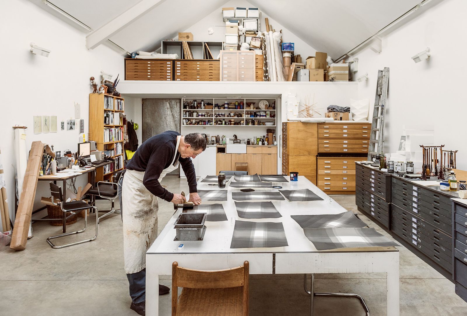 Image may contain Adult Person Chair Furniture Architecture Building Factory Clothing Footwear Shoe and Indoors