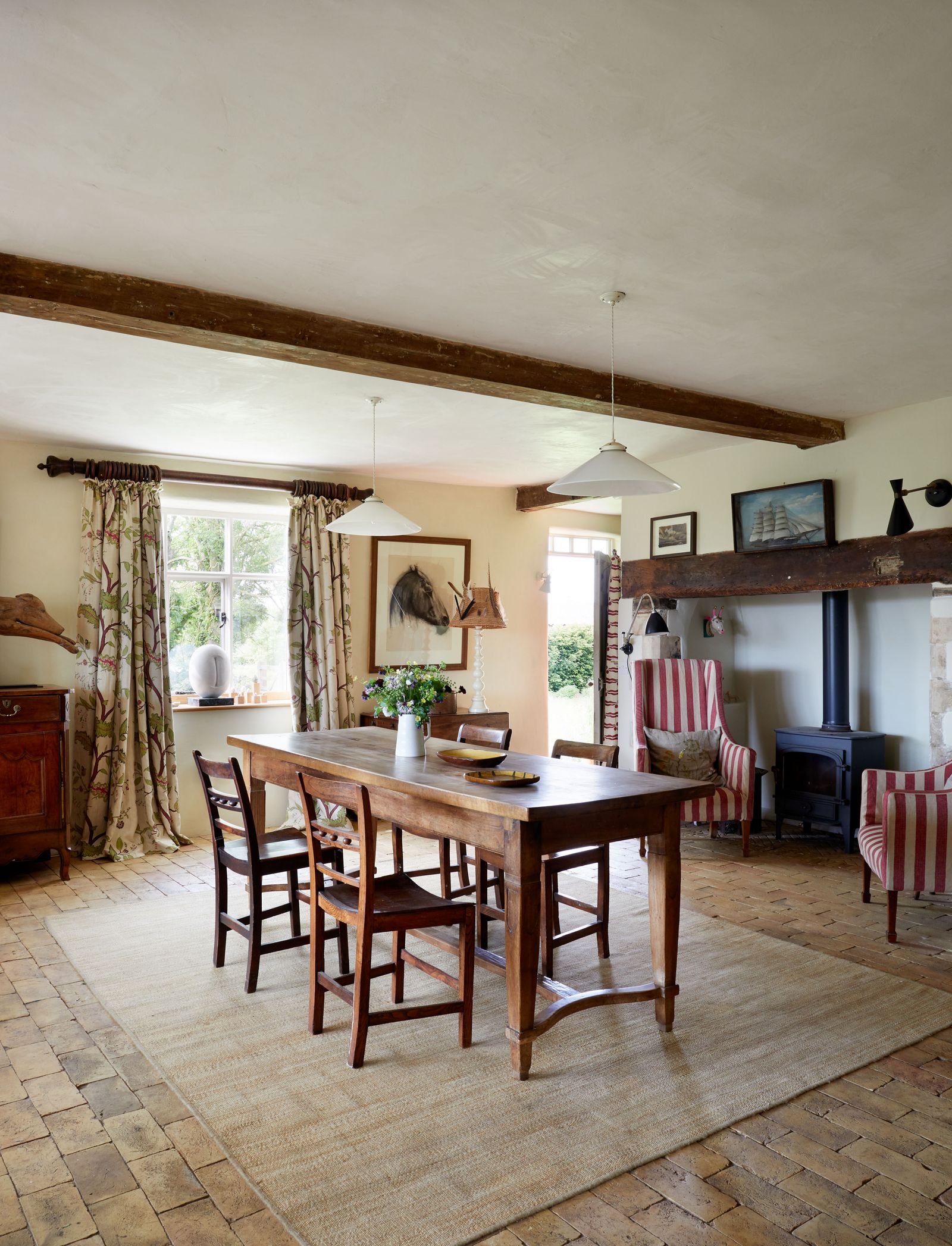 Image may contain Architecture Building Dining Room Dining Table Furniture Indoors Room Table Lamp Chair and Floor