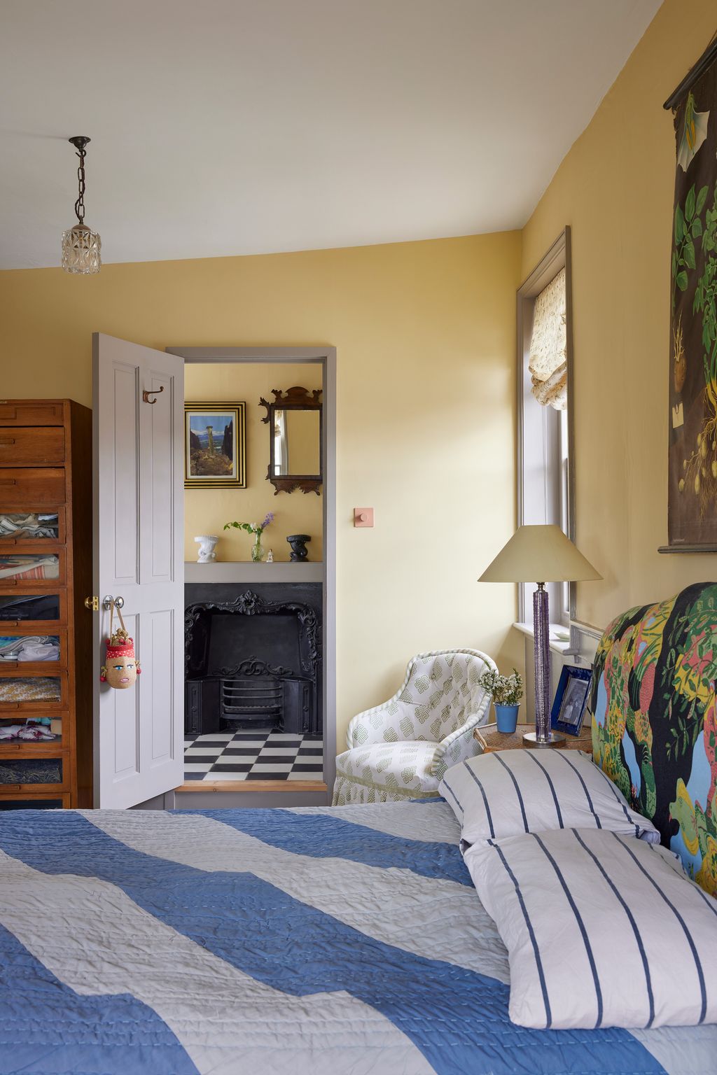 Image may contain Lamp Indoors Interior Design Home Decor Corner Cushion Art Painting Plant Bed and Furniture