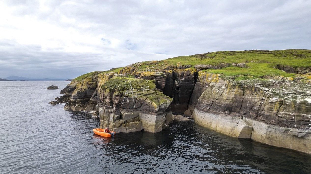 Image may contain Nature Outdoors Sea Water Boat Transportation Vehicle Scenery Shoreline Coast Rock and Land