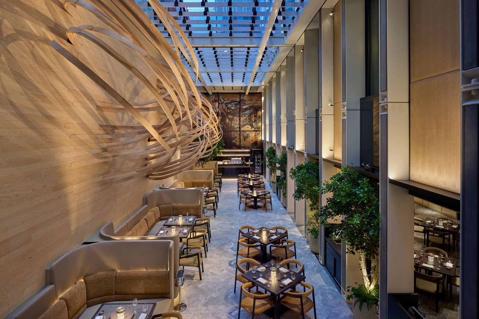 Image may contain Indoors Architecture Building Furniture Lounge Plant Foyer Chair and Person