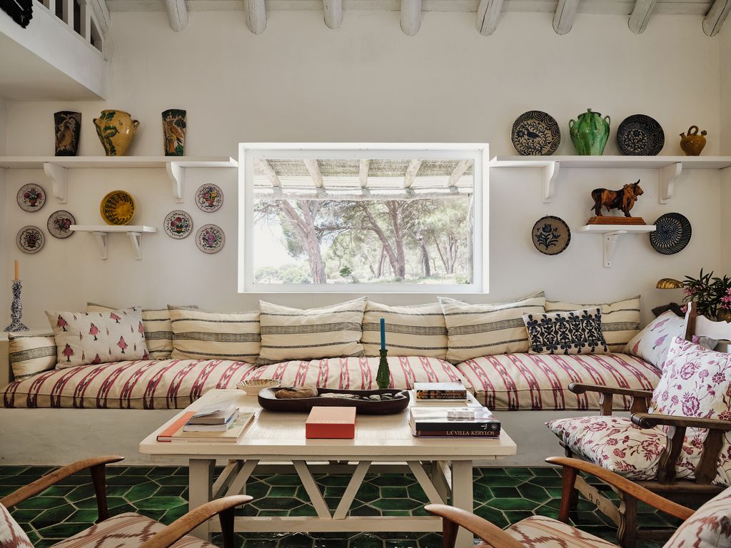 Image may contain Home Decor Couch Furniture Chair Cushion Architecture Building Indoors Living Room and Room