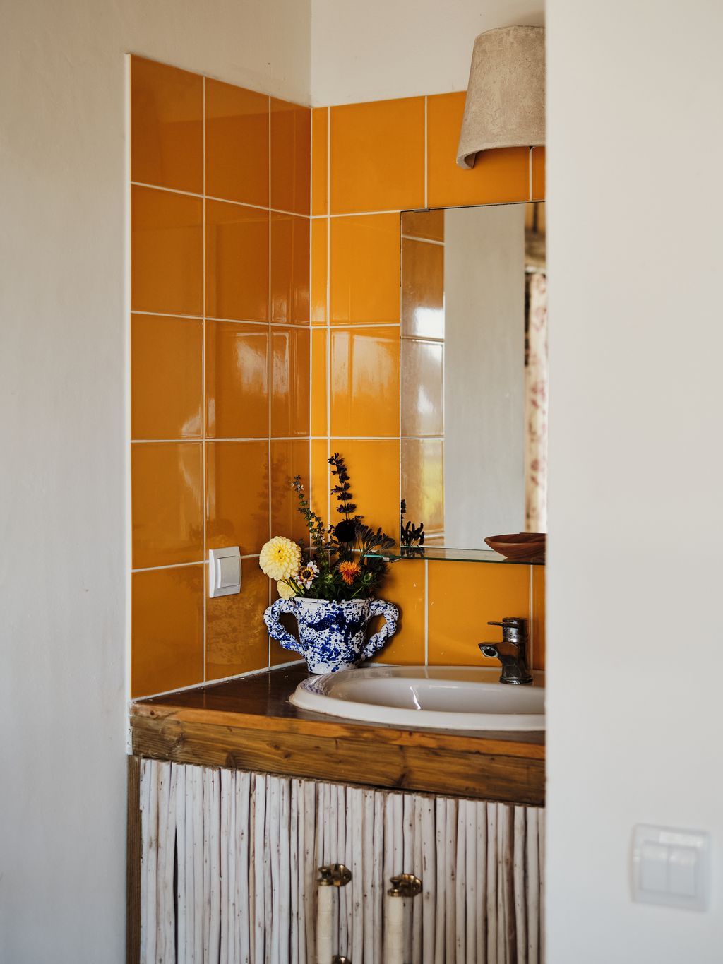 Image may contain Indoors Interior Design Sink Sink Faucet Flower Flower Arrangement and Plant