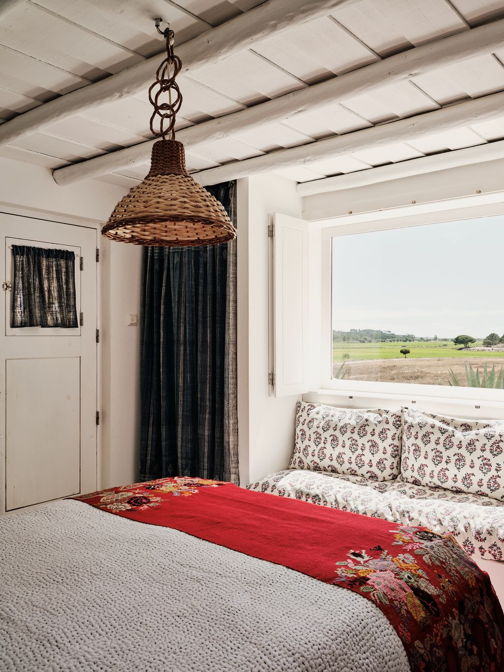 Image may contain Indoors Interior Design Lamp Bed Furniture Home Decor Couch Chandelier Bedroom and Room