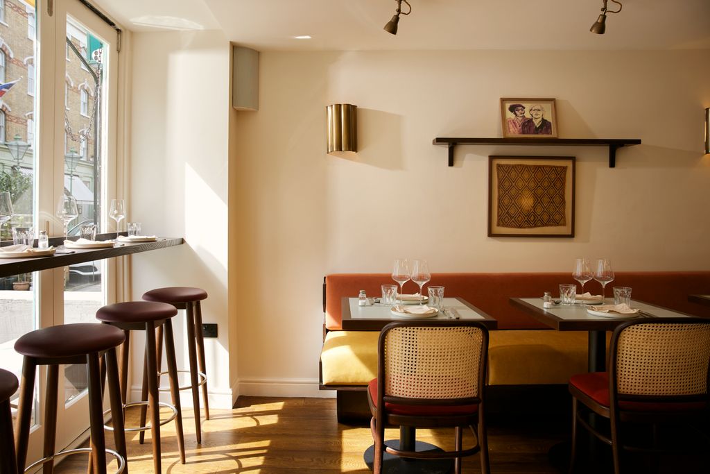 Image may contain Architecture Building Dining Room Dining Table Furniture Indoors Room Table Restaurant and Cup