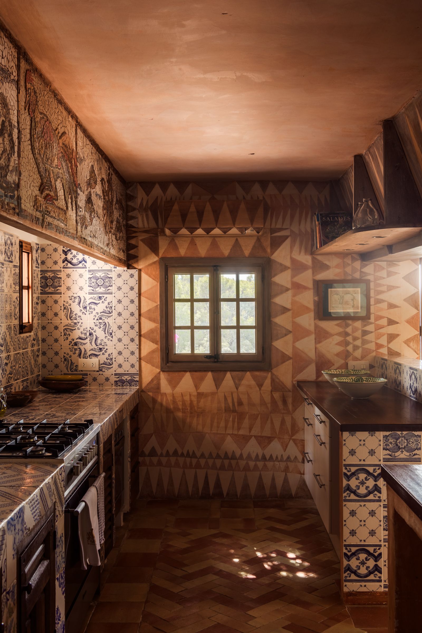 Image may contain Indoors Interior Design Art Painting Cooktop and Kitchen