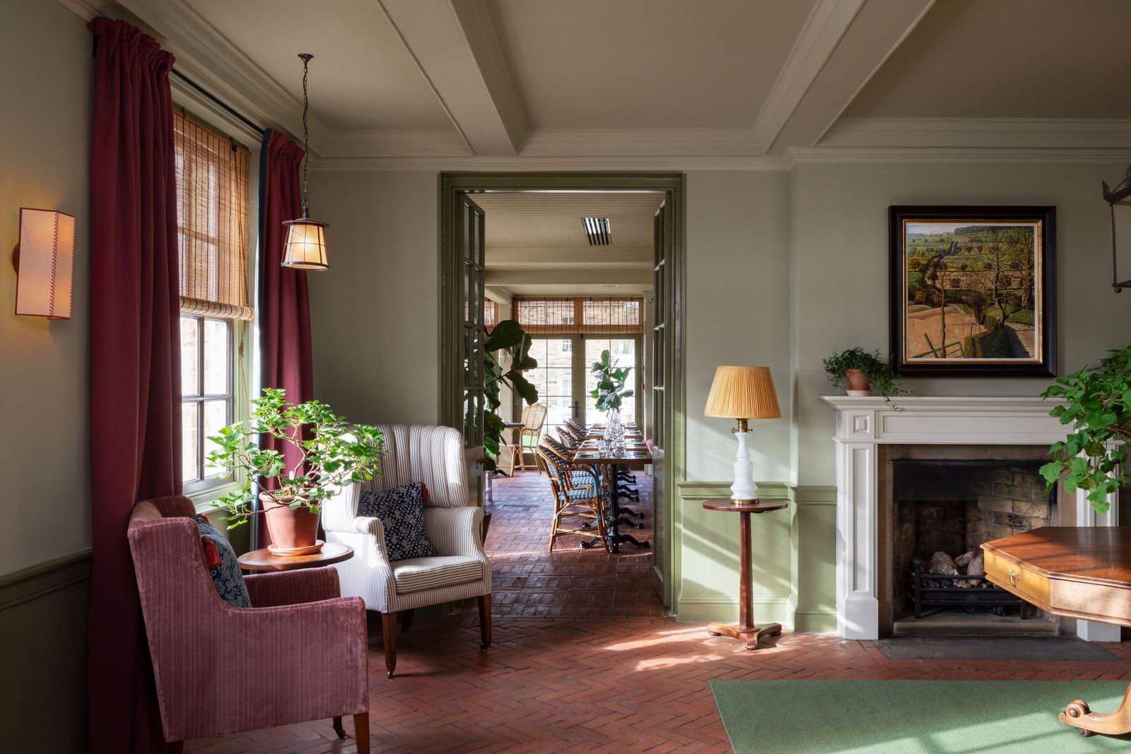 Image may contain Lamp Plant Home Decor Architecture Building Furniture Indoors Living Room Room and Chair