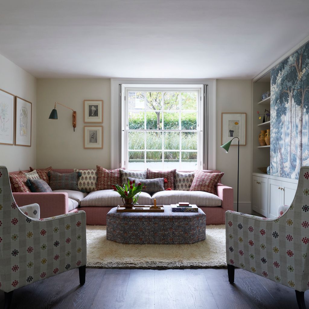 Image may contain Home Decor Art Painting Lamp Furniture Couch Rug Window and Plant