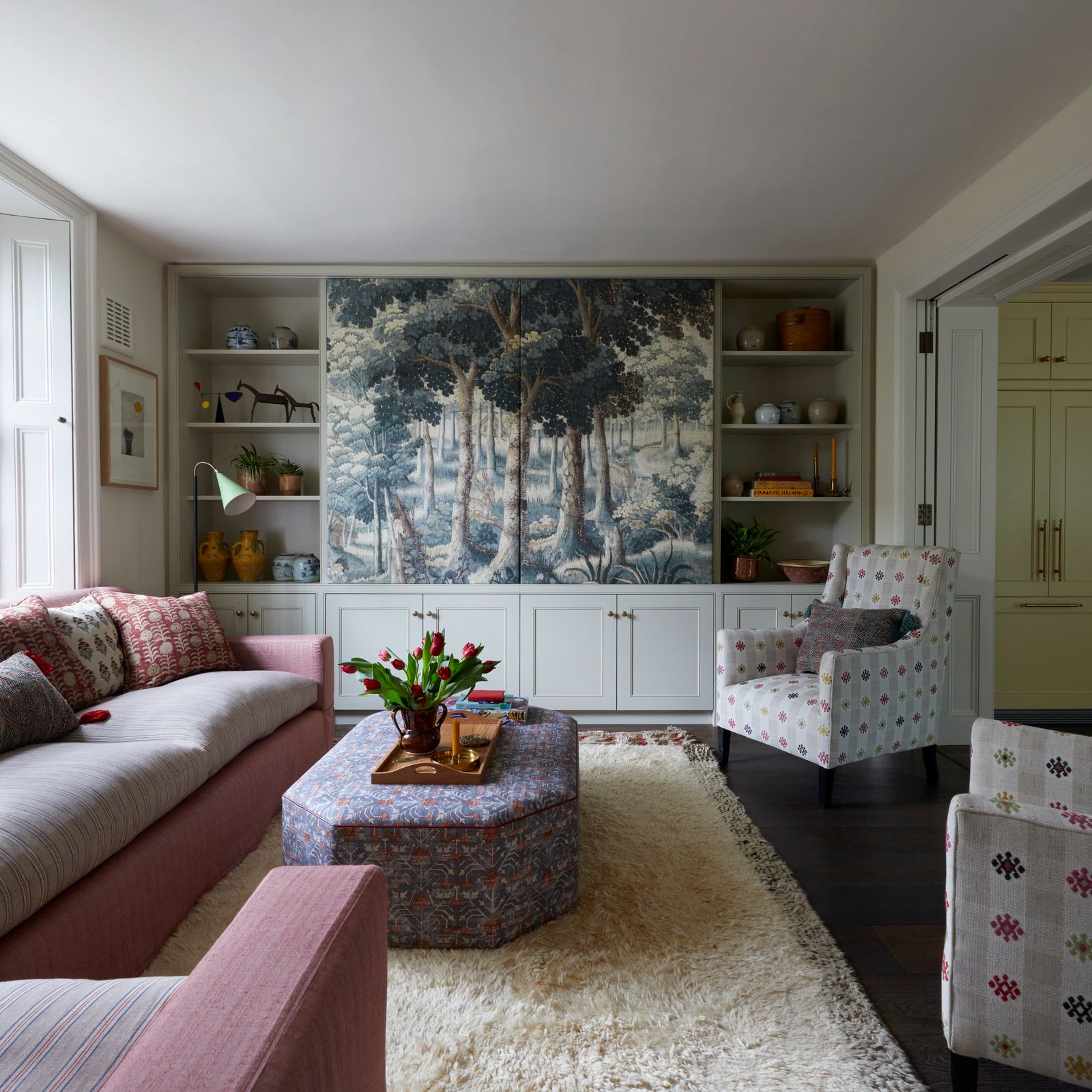 Image may contain Home Decor Plant Couch Furniture Chair Art Painting Rug Lamp Architecture Building and Indoors